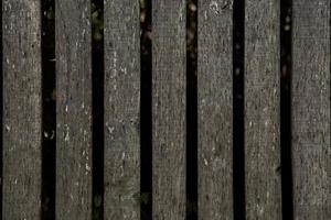 Vintage brown wood background texture with knots and nail holes. Old painted wood wall. Brown abstract background. Vintage wooden dark horizontal boards. photo