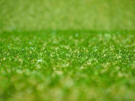 industrial style Green artificial synthetic grass meadow backgro photo