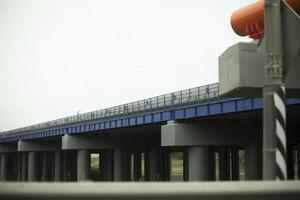 Bridge supports. Transport bridge over the highway. Industrial architecture. Transport hub. photo