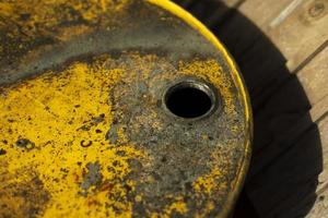 Fuel tank and rust. Steel barrel on street. Hole for receiving fuel. photo
