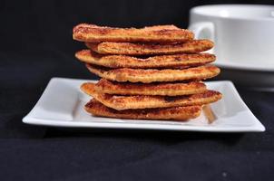 stack of cracker on the white plate photo