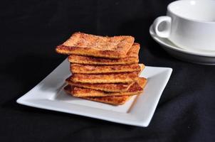 stack of cracker on the white plate photo