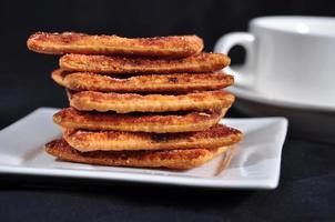 stack of cracker on the white plate photo