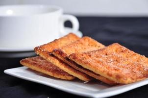 stack of cracker on the white plate photo
