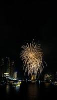 fireworks on the river in the dark sky photo