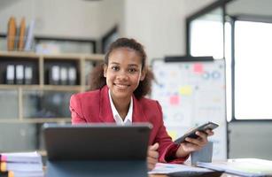 Photo of cheerful positive entrepreneur smiling toothily seeing message from her boss praising her about project finished and startup realized