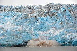 Calving of Ice on a Glacial Face photo