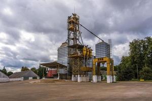 agro silos granary elevator with seeds cleaning line on agro-processing manufacturing plant for processing drying cleaning and storage of agricultural products photo