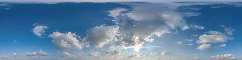 evening blue sky with beautiful clouds as seamless hdri 360 panorama view with zenith for use in 3d graphics or game development as sky dome or edit drone shot photo