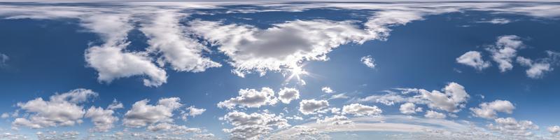 blue sky with beautiful clouds as seamless hdri 360 panorama view with zenith for use in 3d graphics or game development as sky dome or edit drone shot photo