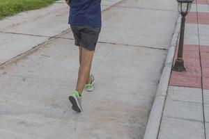 Male runners run on the streets of the park, photo