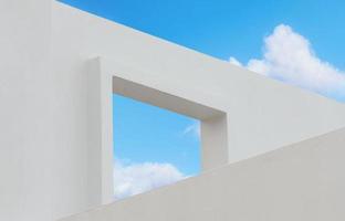 Wall texture of concrete with open window against blue sky and clouds, A part of White cement building, Anyt view Modern architecture. with summer sky, Minimalistic design photo