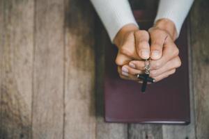 Religious young woman praying to God in the morning, spirtuality and religion, Religious concepts photo