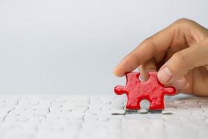 Human hands holding red jigsaw  with word problem  solution.  symbol of association and connection. business strategy. photo