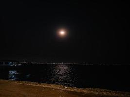 Beautiful moon and ocean on koh larn island Pattaya Thailand photo