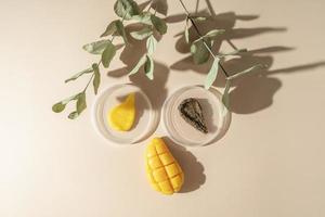 A body care natural mango soap and two smudges for spa procedures lying on a beige background photo