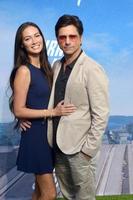 LOS ANGELES - JUL 15 - Caitlin McHugh, John Stamos at Disney Turner and Hooch Premiere Event at Westfield Century City Mall on July 15, 2021 in Century City, CA photo