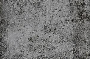Texture of the old embossed concrete wall in gray color. Background image of a concrete product photo