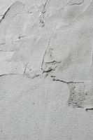 The texture of the wall, covered with gray foam polystyrene plates, which are smeared with a reinforcing mixture. Stage of wall insulation photo