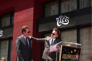 LOS ANGELES - JUL 16 - Aaron Paul, Bryan Cranston at the Hollywood Walk of Fame Star Ceremony for Bryan Cranston at the Redbury Hotel on July 16, 2013 in Los Angeles, CA photo