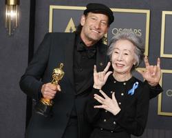 LOS ANGELES - MAR 27 - Troy Kotsur, Youn Yuh-jung at the 94th Academy Awards at Dolby Theater on March 27, 2022 in Los Angeles, CA photo