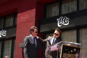 LOS ANGELES - JUL 16 - Aaron Paul, Bryan Cranston at the Hollywood Walk of Fame Star Ceremony for Bryan Cranston at the Redbury Hotel on July 16, 2013 in Los Angeles, CA photo