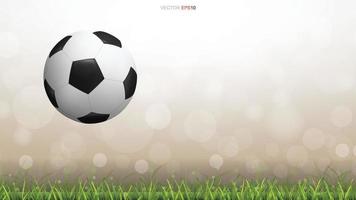 Soccer football ball on green grass field with light blurred bokeh background. Vector. vector
