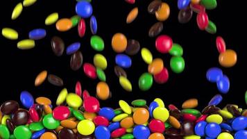 Round colored candies are falling. Alpha channel. 3D rendering video