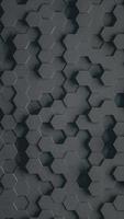 Black geometric hexagonal abstract background. 3D render animation, infinite loop video