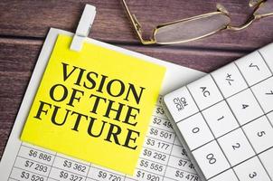 Vision Of The Future words on yellow sticker and calculator photo