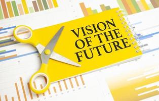 Vision Of The Future words on yellow sticker and charts photo