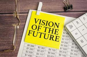 Vision Of The Future words on yellow sticker and calculator