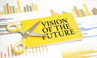 Vision Of The Future words on yellow sticker and charts photo