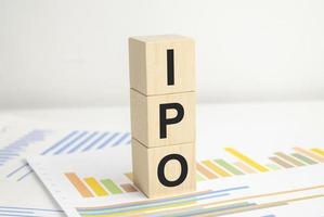 IPO word of wooden cube and charts on white background photo