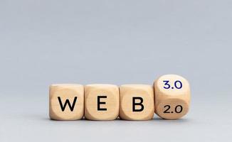 From web 2.0 to web 3.0 concept. Wooden blocks with text on gray background. Copy space photo