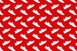 Seamless pattern with white sneakers on red background photo