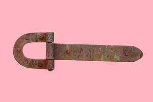 rusty metal door hinge. Door hinge isolated on pink background photo