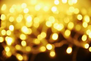 Blurred abstract gold colored background photo