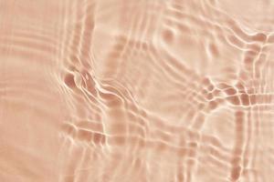 Beige water texture background. Abstract pattern photo