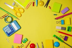 School or office workspace with colored supplies in form circle with space photo