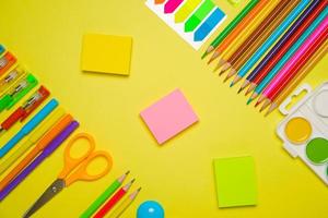 School supplies for drawing, paints colored pencils and pens paper stickers photo