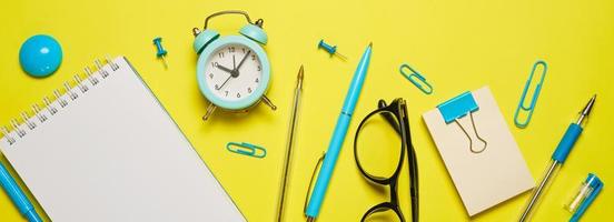 Notebook on a spring for notes and stationery lie on a yellow background Office photo