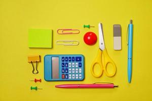 Creative and trendy, school or office workspace with colored supplies photo