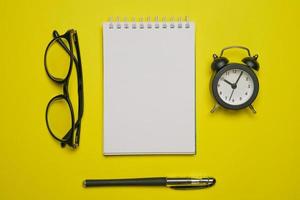 Writer's desk flat composition. Student desk with blank pages notepad, pencil photo