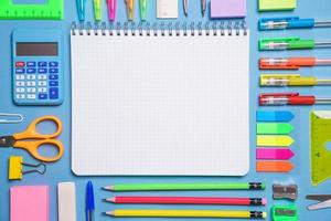 Frame with school supplies on a white background. Flat dip, top view. photo