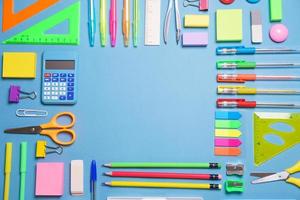 School objects, office supplies, tools and accessories isolated on blue photo