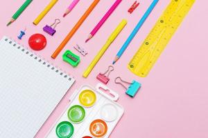 Supplies creative tools for school creative work on pink background photo