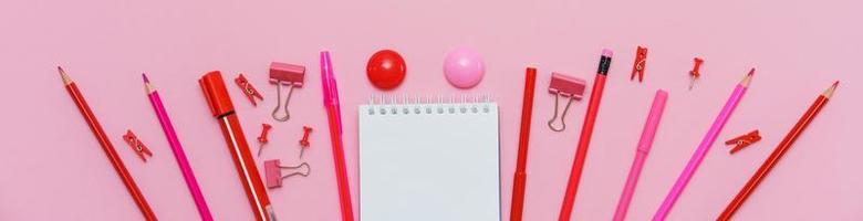 Supplies creative tools for school creative work on pink background photo