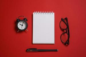 Writer's desk flat composition. Student desk with blank pages notepad, pencil photo