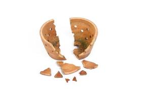Broken antique clay pot on a white background photo